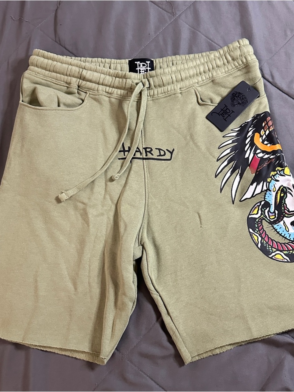 Ed hardy men’s shorts size large green with multicolored design NWT